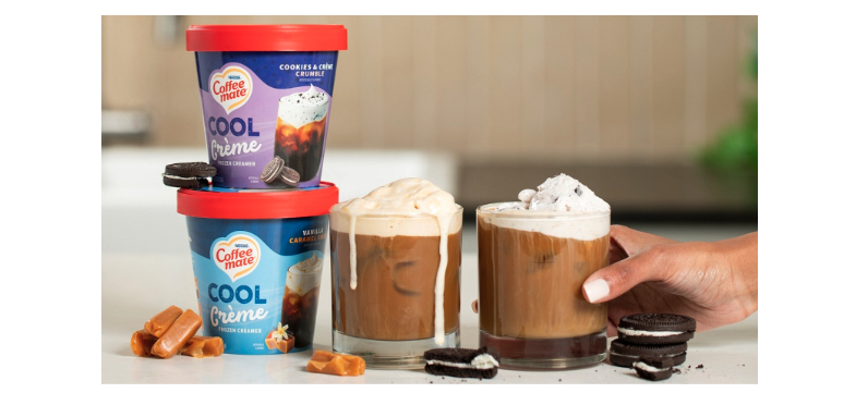 Coffee mate Cool Crème Frozen Creamers on a table stacked on top of each other with glasses next to them
