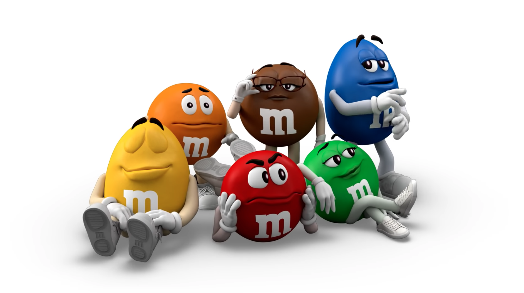 M&M brand characters redesign for present day all sit together casually 