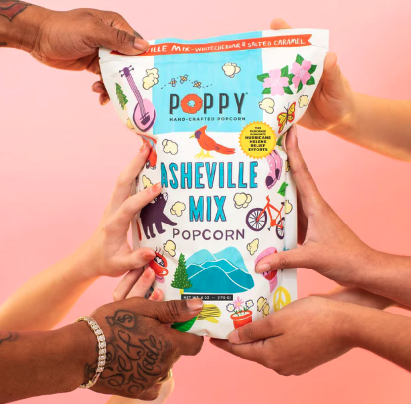 diverse consumers each hold a bag of Asheville Mix popcorn