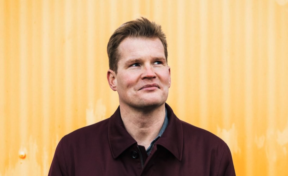  Bragi Valdimir Skúlason looks up as he stands in front of a yellow wall