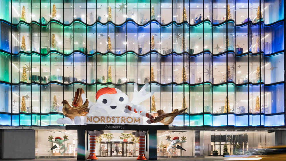 A store features cartoonish Mr Blitz by the store’s street entrance. 